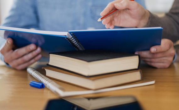 high-angle-man-holding-notebook high-angle-man-holding-notebook